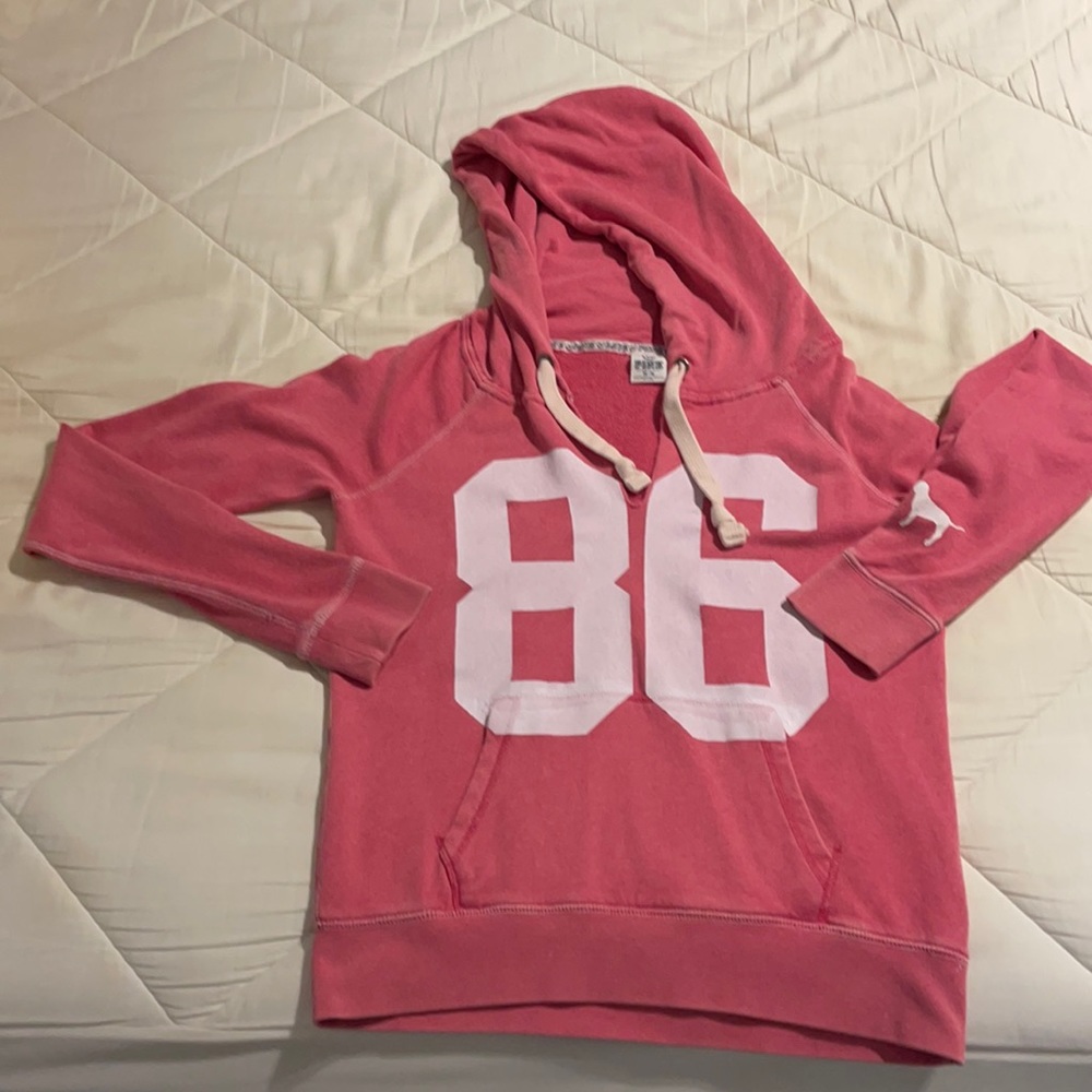 Pink sweater Hood with adjustable drawcord
Kangaroo pocket